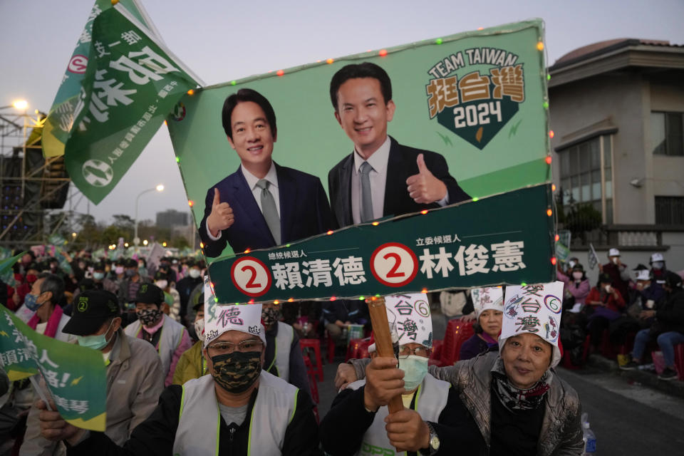 Supporters of the Democratic Progressive Party presidential candidate Lai Ching-te, who also goes by William, cheer at a rally in southern Taiwan's Tainan city on Friday, Jan. 12, 2024 ahead of the presidential election on Saturday. (AP Photo/Ng Han Guan)