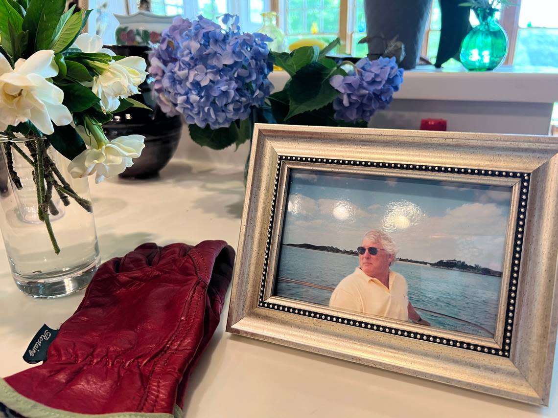 Photos of Randall Ward line the tables and kitchen counters of the Wards’ residence in Raleigh. Susan Ward said her late husband was a “good and honest man” who always tried to give back.