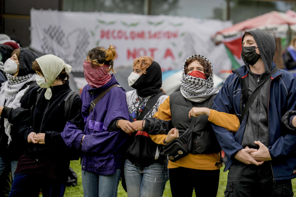 Participants are seen during a pro-Palestinians demonstration by the group "Student Coalition Berlin" in the theater courtyard of the 'Freie Universität Berlin' university in Berlin, Germany, Tuesday, May 7, 2024. Pro-Palestinian activists occupied a courtyard of the Free University in Berlin on Tuesday. (AP Photo/Markus Schreiber)