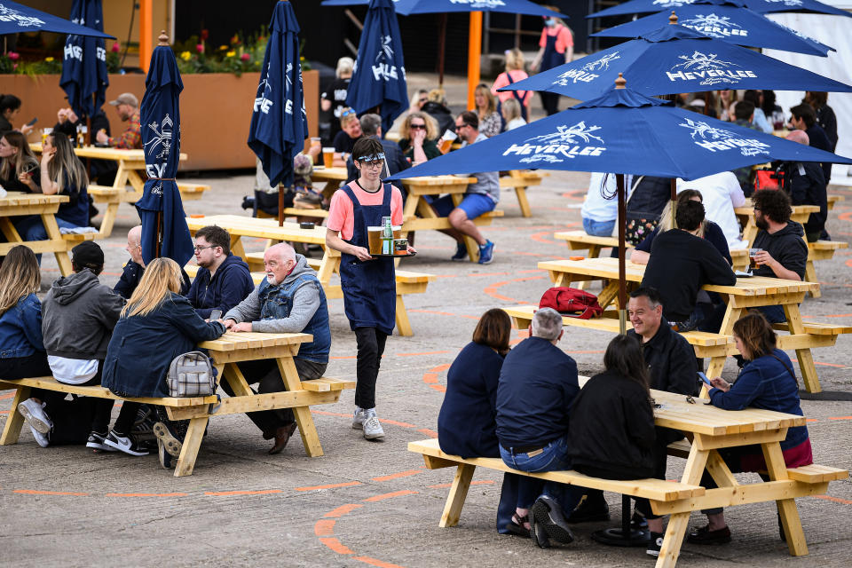 GLASGOW, SCOTLAND - JULY 06: Members of the public enjoy their first drink in a beer garden at SWG3 multi – disciplinary arts venue   on July 06, 2020 in Glasgow, Scotland. Beer gardens across Scotland are permitted to reopen today, as the coronavirus lockdown restrictions are eased further in the country. (Photo by Jeff J Mitchell/Getty Images)