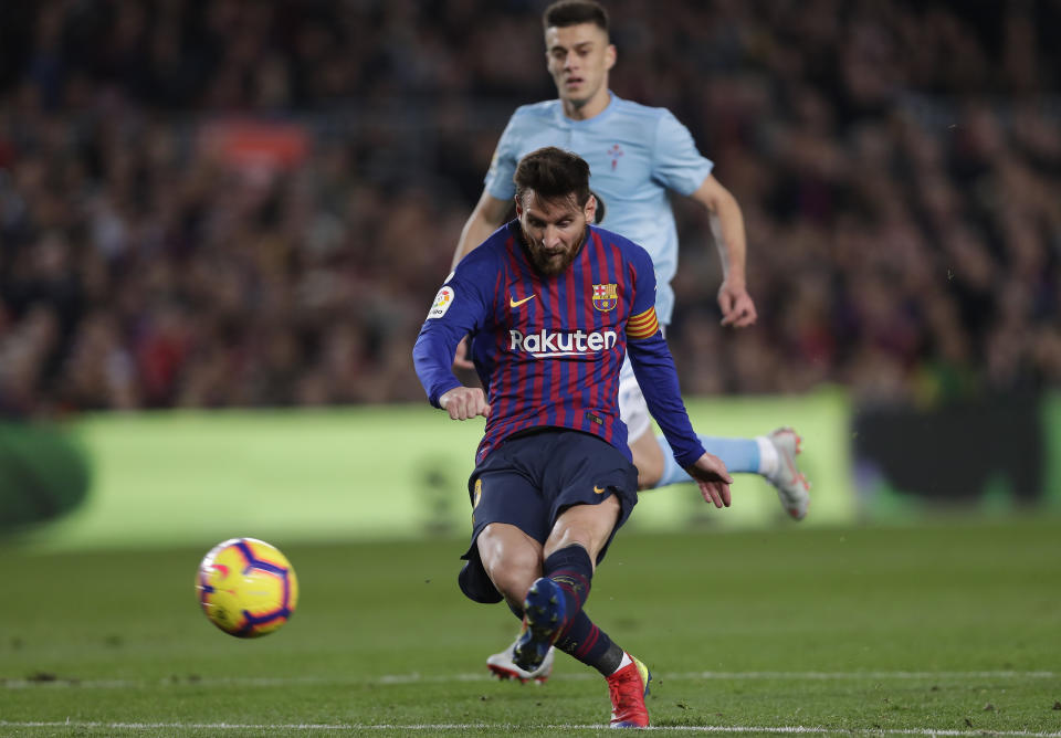 FC Barcelona's Lionel Messi kicks the ball to score during the Spanish La Liga soccer match between FC Barcelona and Celta Vigo at the Camp Nou stadium in Barcelona, Spain, Saturday, Dec. 22, 2018. (AP Photo/Manu Fernandez)