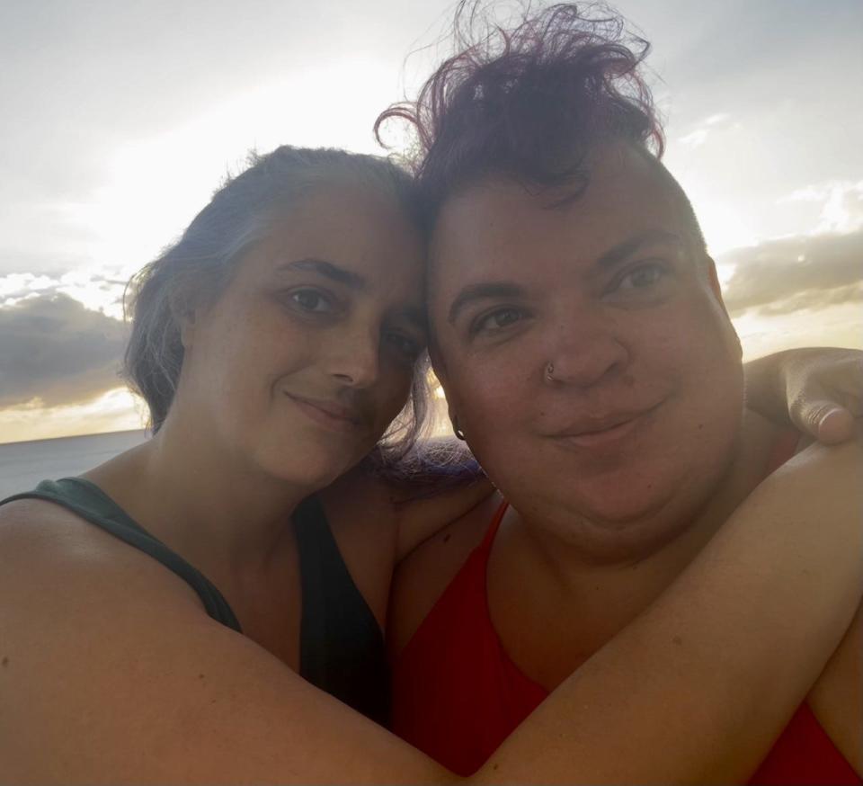 Sharon Moss, right, and their girlfriend, Raven, at sunset on their stateroom balcony.