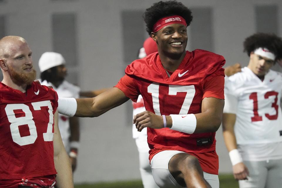 Mar 7, 2024; Columbus, OH, USA; Ohio State Buckeyes wide receiver Carnell Tate (17) stretches with wide receiver Reis Stocksdale (87) during spring football practice at the Woody Hayes Athletic Center.