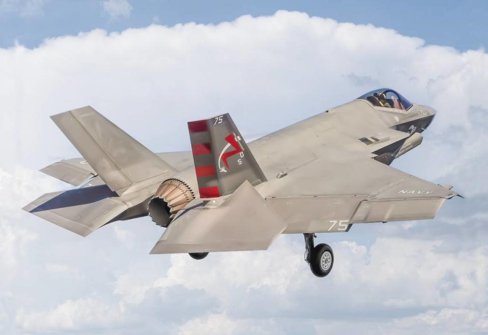 An F-35C aircraft for the U.S. Navy flies in the sky.