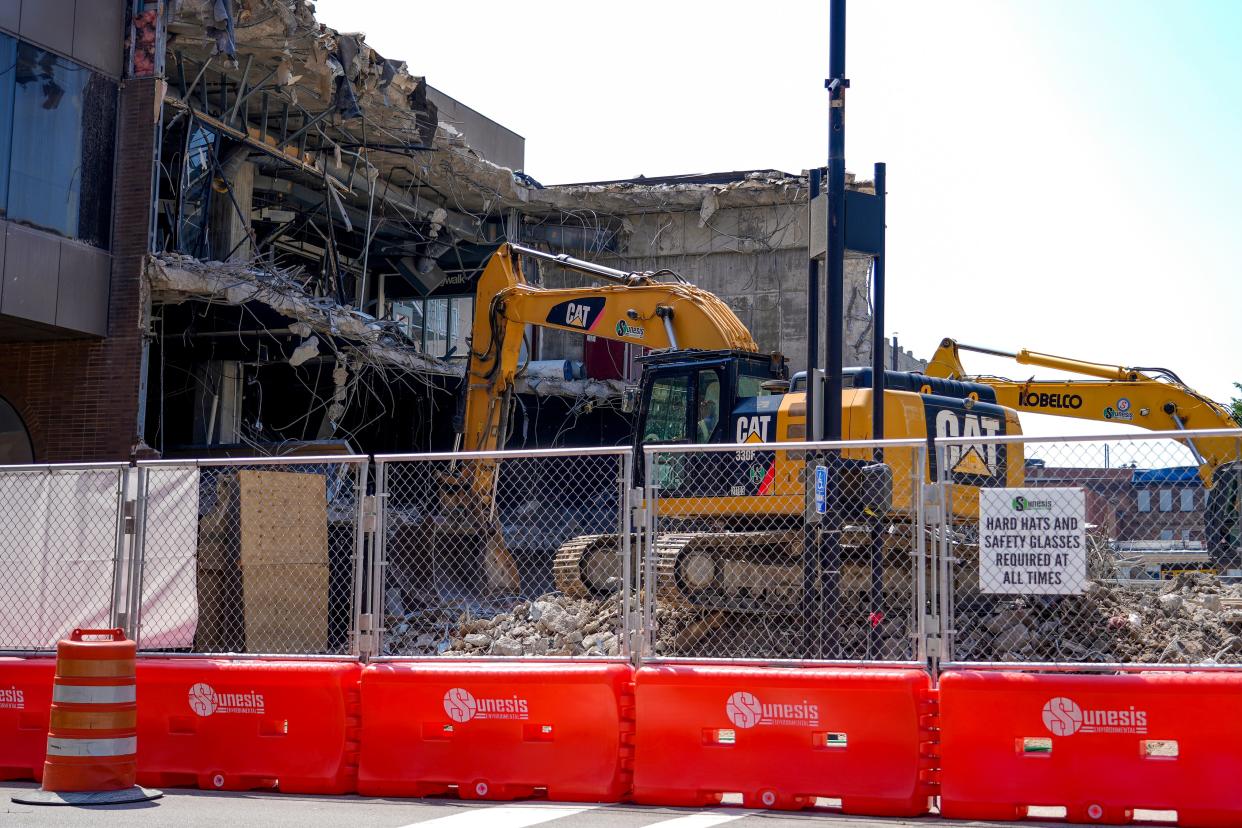 Construction excavators destroy what is left of Convention Place Mall, located at 435 Elm Street on Tuesday, Aug. 22, 2023 near the Duke Energy Convention Center in Cincinnati.