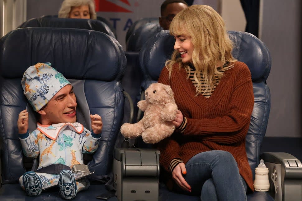 Adam Driver and Sarah Sherman in the 'Plane Baby' skit on 'SNL' in December 2023