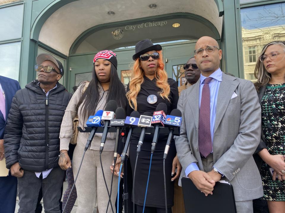 Nicole Banks, center, speaks at a news conference in Chicago following the release of the bodycam footage showing her son Dexter Reed's death. Porscha Banks, Reed's sister, stands to her left, and Andrew M. Stroth, a prominent local civil rights attorney, to her right.