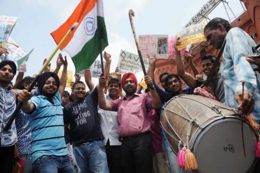 Indian field hockey fans cheer on their Olympic team players in Amritsar on July 26,2012. India has sent its largest contingent ever to the Olympics with as many as 81 athletes set to compete in 13 sporting events