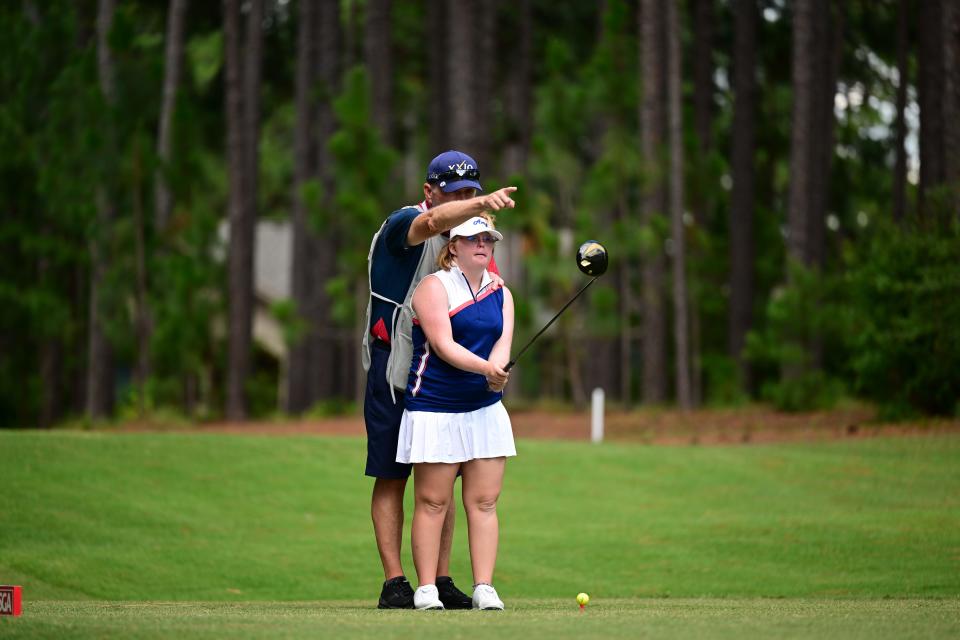 Amy Bockerstette checks her shot on hole 17 with her caddie during the first round at the 2022 U.S. Adaptive Open at Pinehurst Resort &amp; C.C. (Course No. 6) in Village of Pinehurst, N.C. on Monday, July 18, 2022.