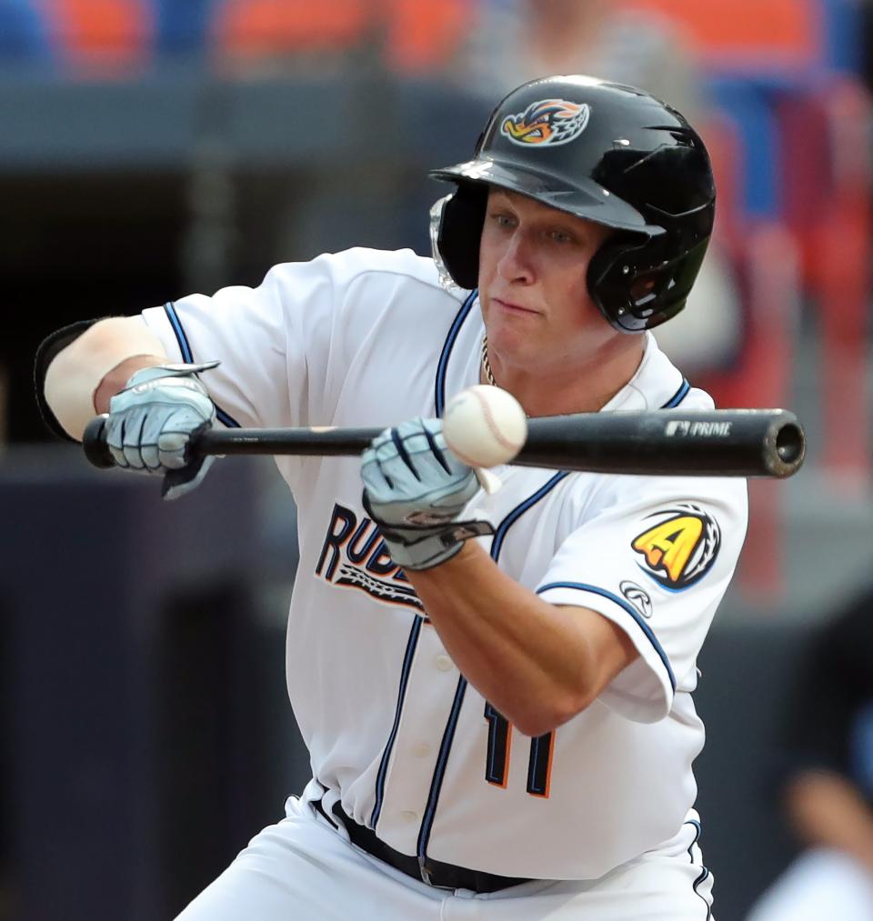 Akron RubberDucks centerfielder Petey Halpin singles on a bunt against the Richmond Flying Squirrels during the first inning of a Minor League Baseball game at Canal Park, Thursday, July 20, 2023, in Akron, Ohio.