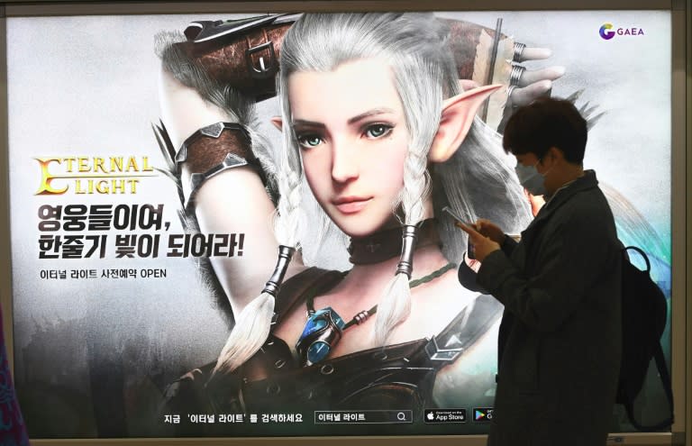 A billboard advertising a mobile game at a subway station in Seoul