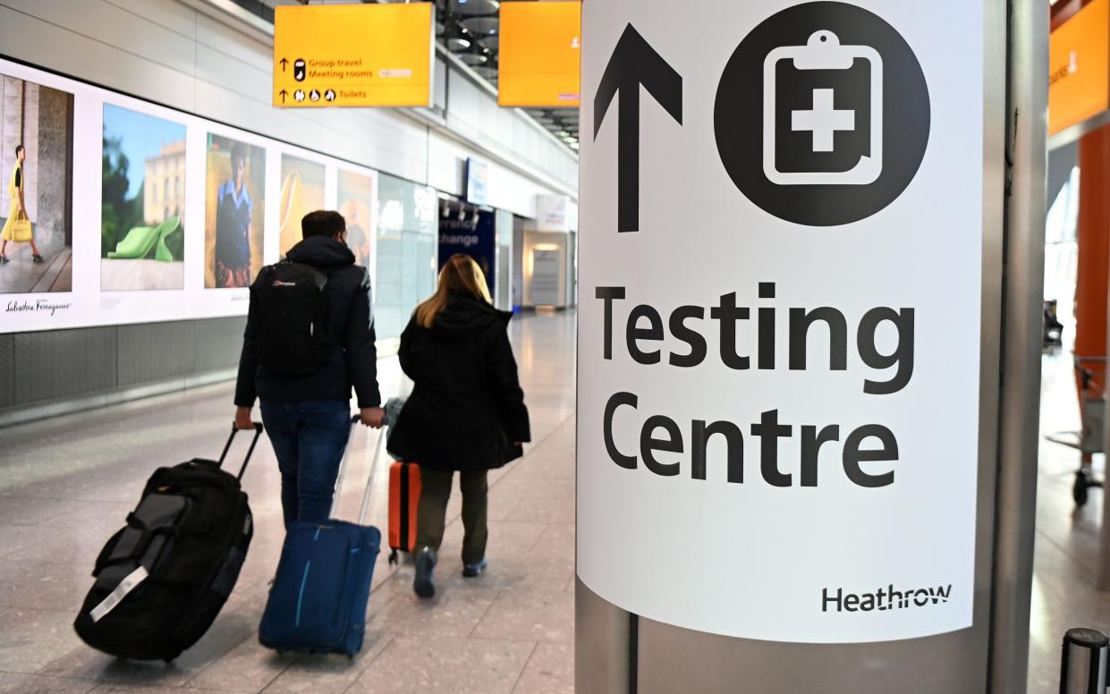 Passengers arrive at Heathrow Airport in London - Andy Rain/Shutterstock 