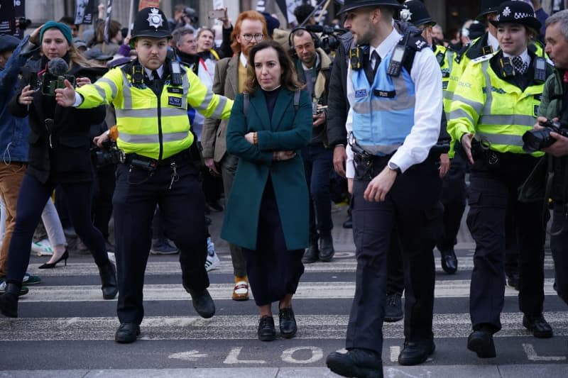 Stella Assange, the wife of Julian Assange, leaves the Royal Courts of Justice, at the end of the first day of a two-day hearing in the extradition case of the WikiLeaks founder. Yui Mok/PA Wire/dpa