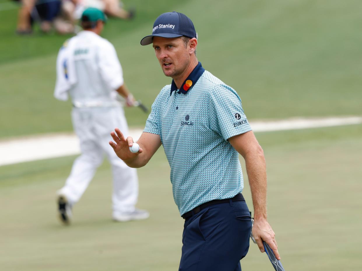 <p>Dustin Johnson poses with the trophy at August in 2020</p> (REUTERS)