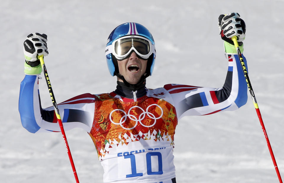 France's Steve Missillier celebrates after finishing the second run in the men's giant slalom at the Sochi 2014 Winter Olympics, Wednesday, Feb. 19, 2014, in Krasnaya Polyana, Russia.(AP Photo/Christophe Ena)