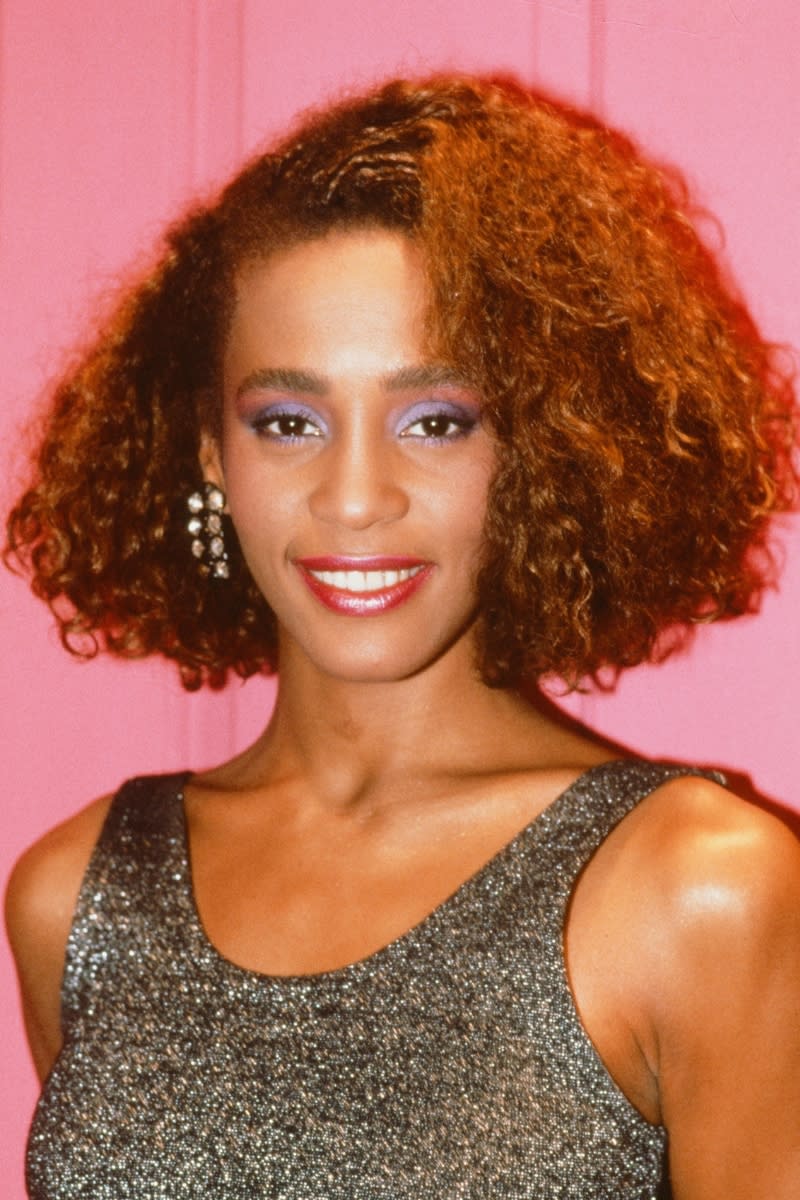 Whitney Houston pictured wearing shiny lipstick