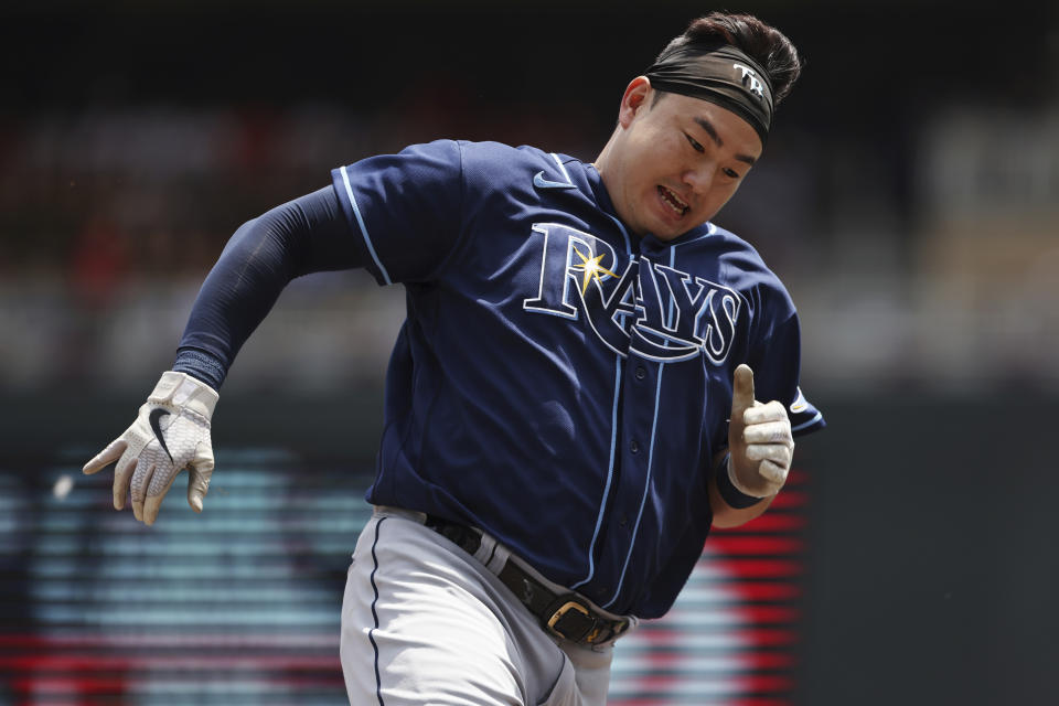 Tampa Bay Rays' Ji-Man Choi runs toward home base after Yandy Diaz hit a single during the first inning of a baseball game against the Minnesota Twins, Saturday, June 11, 2022, in Minneapolis. (AP Photo/Stacy Bengs)