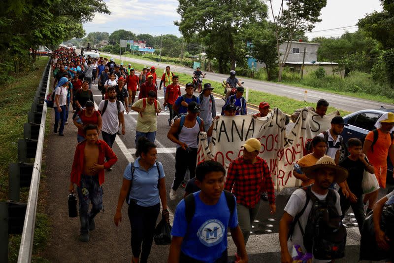 Migrants walk in a caravan to reach the U.S. border, in Tapachula