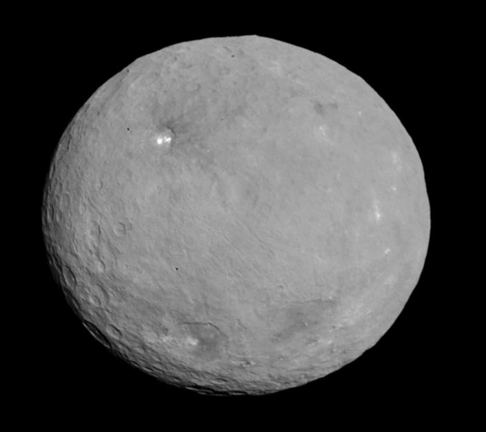 The largest object in the asteroid belt is the circular shaped Ceres. Since 2015, NASA's Dawn spacecraft has orbited and photographed the nearly 600-mile-wide dwarf planet, including its numerous brightly lit areas, like the two bright lights of the crater called Occator.