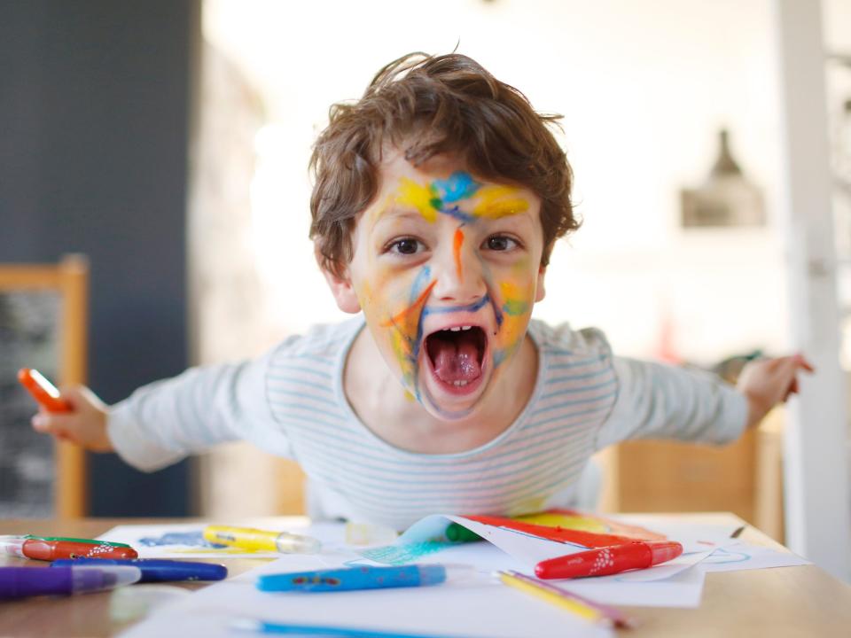 child with marker on face