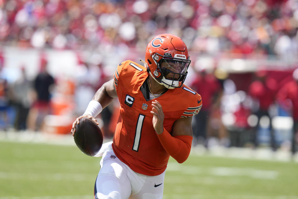 Chicago Bears quarterback <a class="link " href="https://sports.yahoo.com/nfl/players/33399" data-i13n="sec:content-canvas;subsec:anchor_text;elm:context_link" data-ylk="slk:Justin Fields;sec:content-canvas;subsec:anchor_text;elm:context_link;itc:0">Justin Fields</a> runs the ball into the end zone for a touchdown during the first half of an NFL football game against the <a class="link " href="https://sports.yahoo.com/nfl/teams/tampa-bay/" data-i13n="sec:content-canvas;subsec:anchor_text;elm:context_link" data-ylk="slk:Tampa Bay Buccaneers;sec:content-canvas;subsec:anchor_text;elm:context_link;itc:0">Tampa Bay Buccaneers</a>, Sunday, Sept. 17, 2023, in Tampa, Fla. (AP Photo/Chris O’Meara) ORG XMIT: TPS106