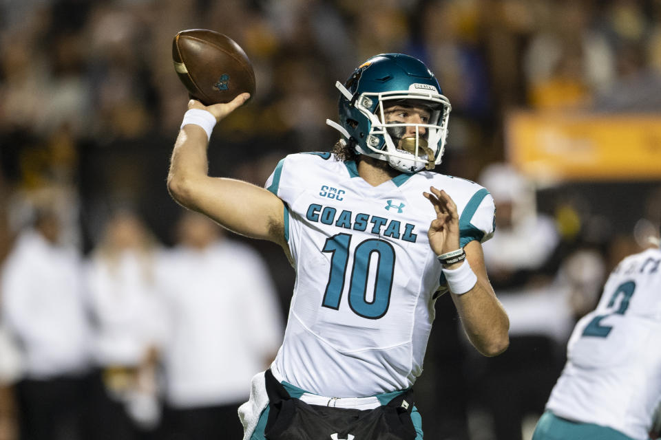 Coastal Carolina quarterback Grayson McCall (10) throws a pass during the first half of the team's NCAA college football game against Appalachian State on Wednesday, Oct. 20, 2021, in Boone, N.C. (AP Photo/Matt Kelley).