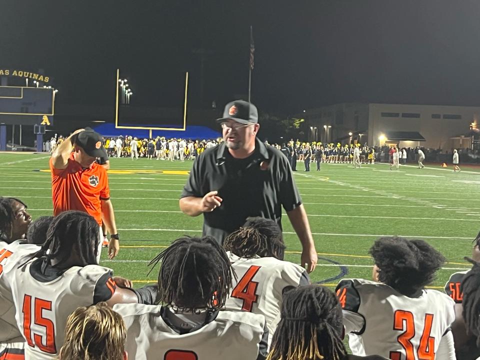 Cocoa High head football coach Ryan Schneider talks to his team after a last-second loss to St. Thomas Aquinas on the road, Sept. 8, 2023.