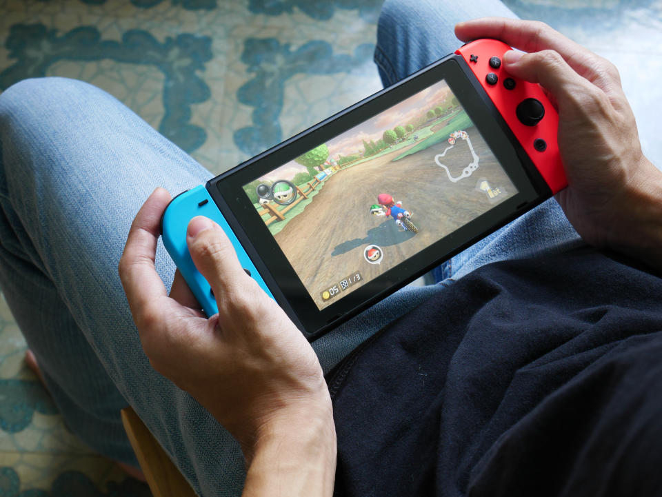 a person playing nintendo switch