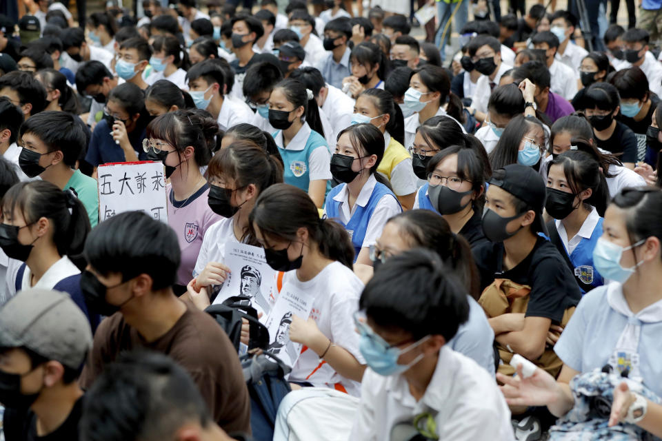 Students gather during a school children's strike event in support of protest movement in Hong Kong Monday, Sept. 30, 2019. Hong Kong authorities Monday rejected an appeal for a major pro-democracy march on National Day’s holiday after two straight days of violent clashes between protesters and police in the semi-autonomous Chinese territory roused fears of more showdowns that would embarrass Beijing. (AP Photo/Gemunu Amarasinghe)