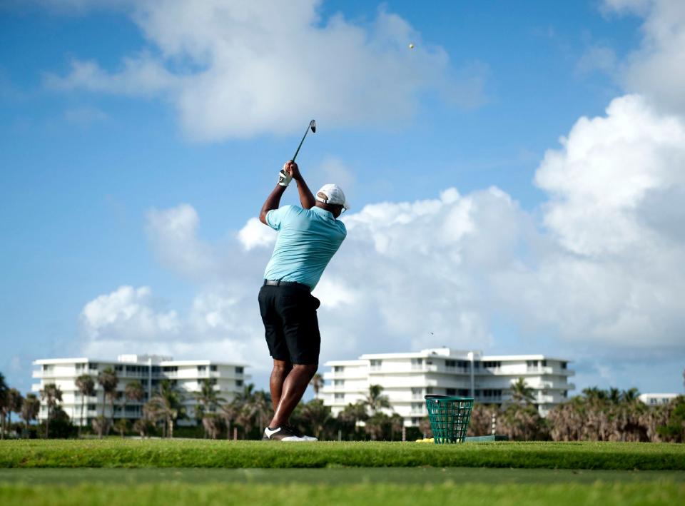 Robert Mitchell warms up before the Literacy Links Golf Tournament to benefit the Literacy Coalition of Palm Beach County at the Par 3 in June. MEGHAN McCARTHY/Palm Beach Daily News