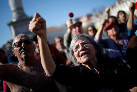 FILE PHOTO: People sing during a march marking the Carnation Revolution's 42nd anniversary in Lisbon, Portugal April 25, 2016. REUTERS/Rafael Marchante/File Photo