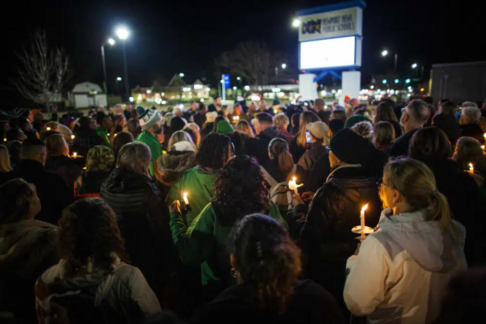 Residents of Newport News hold a candlelight vigil in honor of Richneck Elementary School first-grade teacher Abby Zwerner at the School Administration Building in Newport News, Va., Monday, Jan. 9, 2023. (AP Photo/John C. Clark)