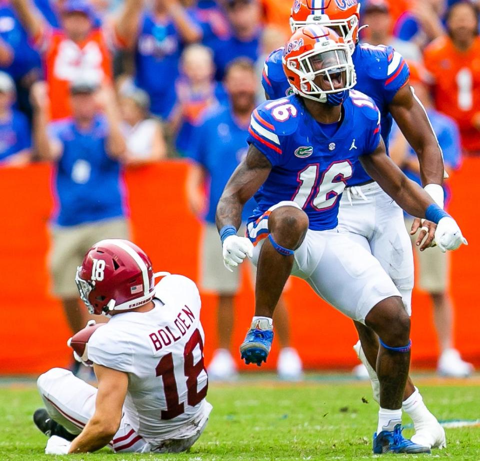 Florida Gators safety Tre'Vez Johnson (16) celebrates an open field tackle on Alabama Crimson Tide wide receiver Slade Bolden (18). Florida Gators lost their first SEC game against Alabama, 31-29 at Ben Hill Griffin Stadium Saturday afternoon, September 18, 2021, in Gainesville, FL.  [Doug Engle/Gainesville Sun]2021