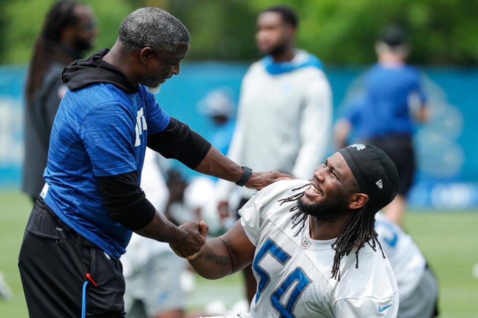 Detroit Lions defensive coordinator Aaron Glenn talks to defensive tackle Alim McNeill (54) during minicamp at Detroit Lions Headquarters and Training Facility in Allen Park on Tuesday, June 6, 2023.