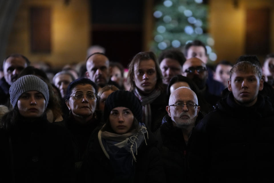 Mourners attend memorial service for the victims of Philosophical Faculty of Charles University shooting in the St. Vitus Cathedral in Prague, Czech Republic, Saturday, Dec. 23, 2023. Czech police are investigating why a student went on a dayslong violent rampage culminating in a shooting at the university he attended in Prague that left 14 dead and dozens wounded. (AP Photo/Petr David Josek)