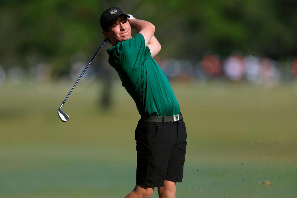 Ryan Nicholson of Nease watches his approach shot from the first fairway of the St. Johns Golf Club during the Region 1-3A boys golf tournament. Nicholson's 70 helped the Panthers win the region title.