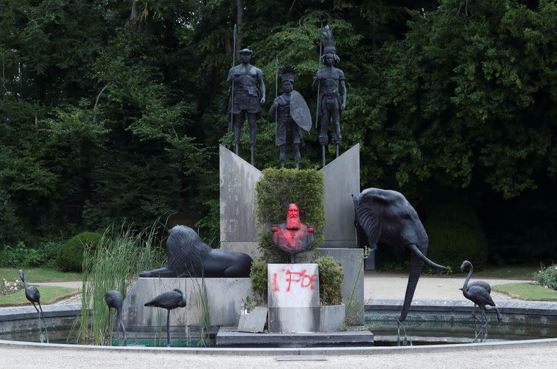 FILE PHOTO: A statue of former Belgian King Leopold II sprayed with a graffiti is seen in the park of the Africa Museum, in Tervuren