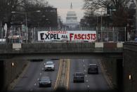 A banner with a message for members of the U.S. Congress hangs over a popular thoroughfare in Washington