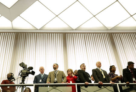 Department of State employees await the arrival of U.S. Secretary of State Rex Tillerson at the Department of State in Washington, U.S., February 2, 2017. REUTERS/Joshua Roberts