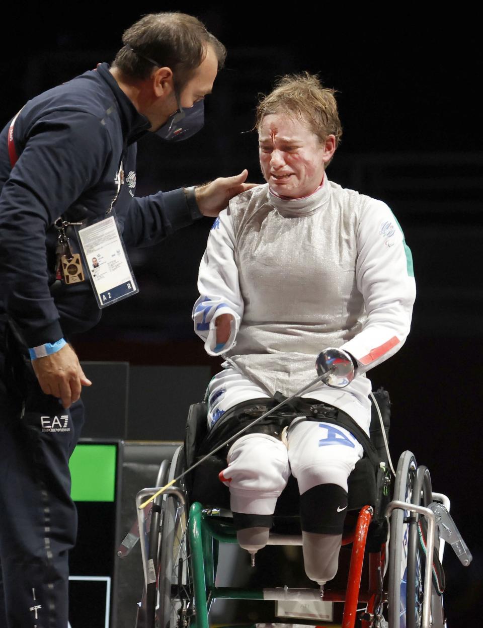 Italy's Beatrice Maria Vio celebrates after winning over China's Zhou Jingjing during their the wheelchair fencing women's foil Individual category B gold medal match in Chiba, near Tokyo, at the Tokyo 2020 Paralympic Games, Saturday, Aug. 28, 2021, in Tokyo, Japan. (Kyodo News via AP)