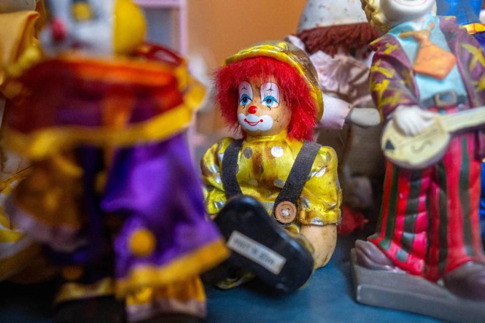 Clown dolls sit in cases below the front desk of Pancake Circus in Sacramento earlier this month.