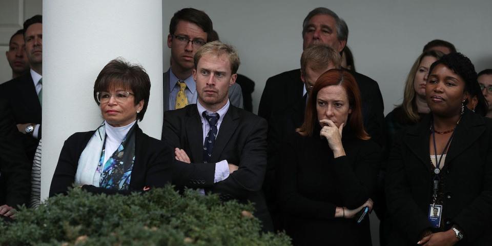 White House staff, including Press Secretary Josh Earnest (2nd L), senior advisor Valerie Jarrett (3rd L) and Communication Director Jen Psaki (2nd R), listen as U.S. President Barack Obama makes a statement on the election results at the Rose Garden of the White House November 9, 2016.