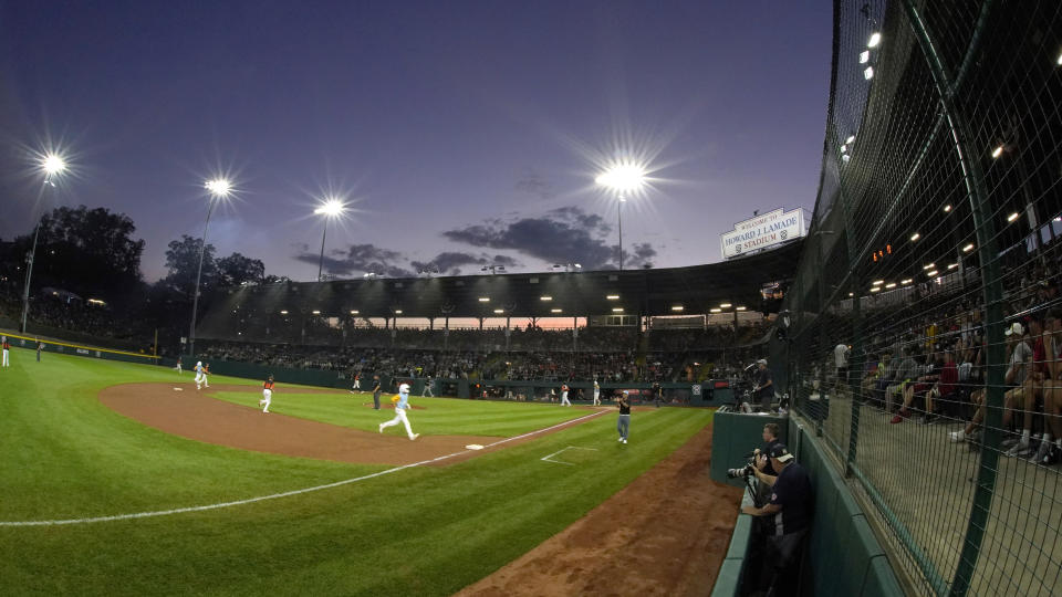 Massapequa, N.Y and Honolulu play in a baseball game at Lamade Stadium at the Little League World Series in South Williamsport, Pa., Friday, Aug. 19, 2022. (AP Photo/Gene J. Puskar)