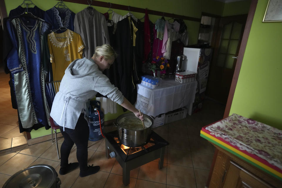 Members of a Muslim congregation cook soup for migrants at the Polish-Belarusian border in Bohoniki near Sokolka, Poland, Saturday, Nov. 13, 2021. (AP Photo/Matthias Schrader)