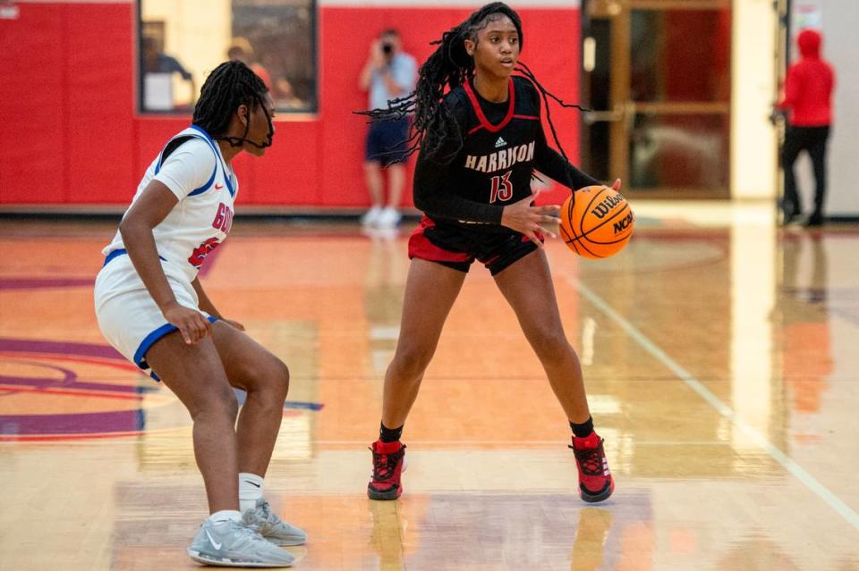 Harrison Central’s Jayla Carriere looks for a pass during a game at Pascagoula High School on Tuesday, Dec. 5, 2023.