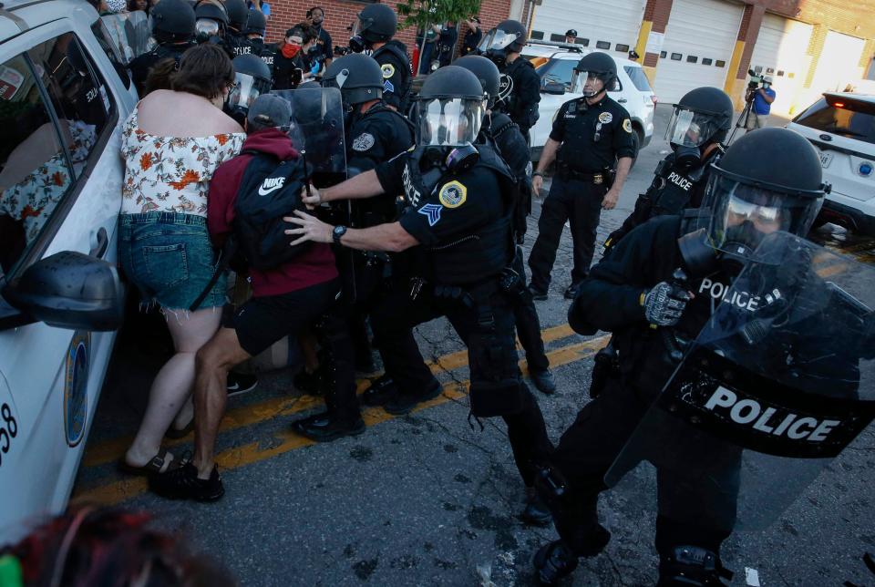 Protesters clash with Des Moines police during a protest on Friday, May 29, 2020, in Des Moines. The protests were a response to the recent death of George Floyd, a Minneapolis man who was killed by a Minneapolis police officer. 