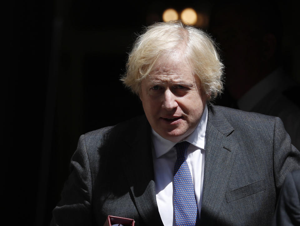 Britain's Prime Minister Boris Johnson leaves 10 Downing Street to attend his weekly Prime Minister Questions at the House of Commons,  in London, Wednesday, June 24, 2020. (AP Photo/Alastair Grant)