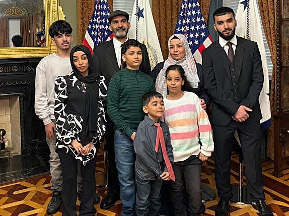 Souad Mahfoud, 44, second from right, takes a photo with her family on a visit to the White House in this undated photo. With her are, back row from left, son Ammar Aloush, 15; husband Omar Aloush, 49; and son Hayan Aloush, 22; middle row from left, daughter Hala Aloush, 16; son Mohammed, Aloush 14; and daughter Raneem Aloush, 11; and front, son Adam Aloush, 6. Missing from the photo is daughter Haneen Aloush, 20.