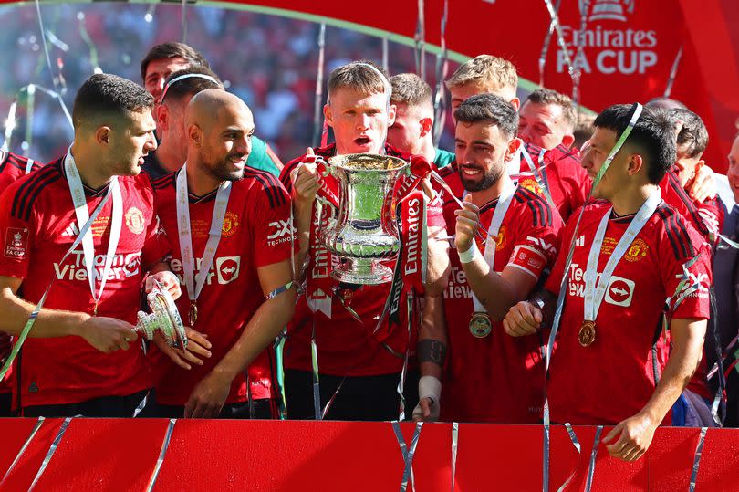 Manchester United's Scott McTominay celebrates with the trophy after the Emirates FA Cup Final between Manchester City and Manchester United.