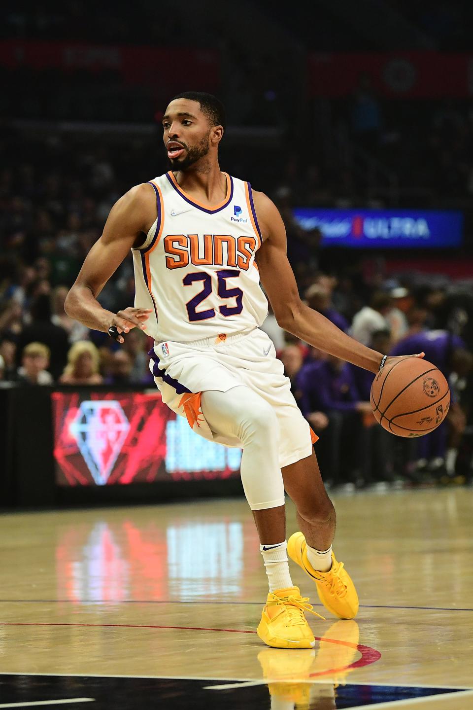 Apr 6, 2022; Los Angeles, California, USA;  Phoenix Suns forward Mikal Bridges (25) controls the ball against the Los Angeles Clippers during the first half at Crypto.com Arena.